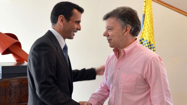 REUNIÓN PRIVADA. El encuentro Santos-Capriles ha desatado la ira del Gobierno venezolano. (EFE)