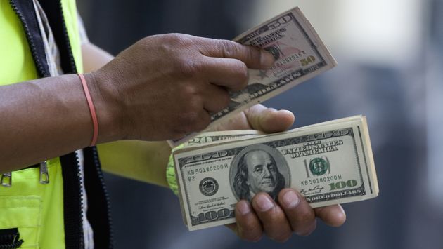 El dólar cerró el 2013 en S/.2.80, su primera alza en cuatro años. (USI)