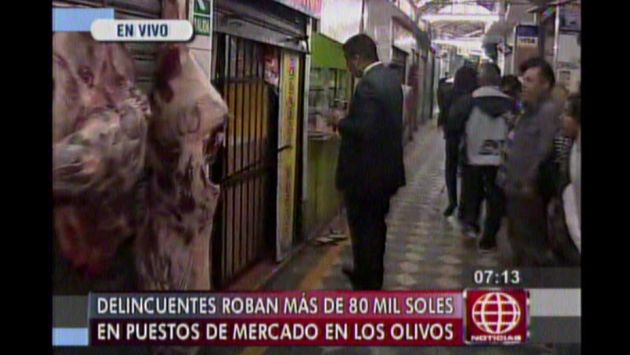 Cuatro delincuentes asaltaron mercado en Los Olivos y se llevaron más de S/.80 mil. (Captura de TV)
