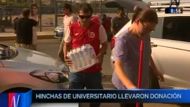 Universitario de Deportes: Hinchas llevaron donación a comerciantes afectados.  (Canal N)